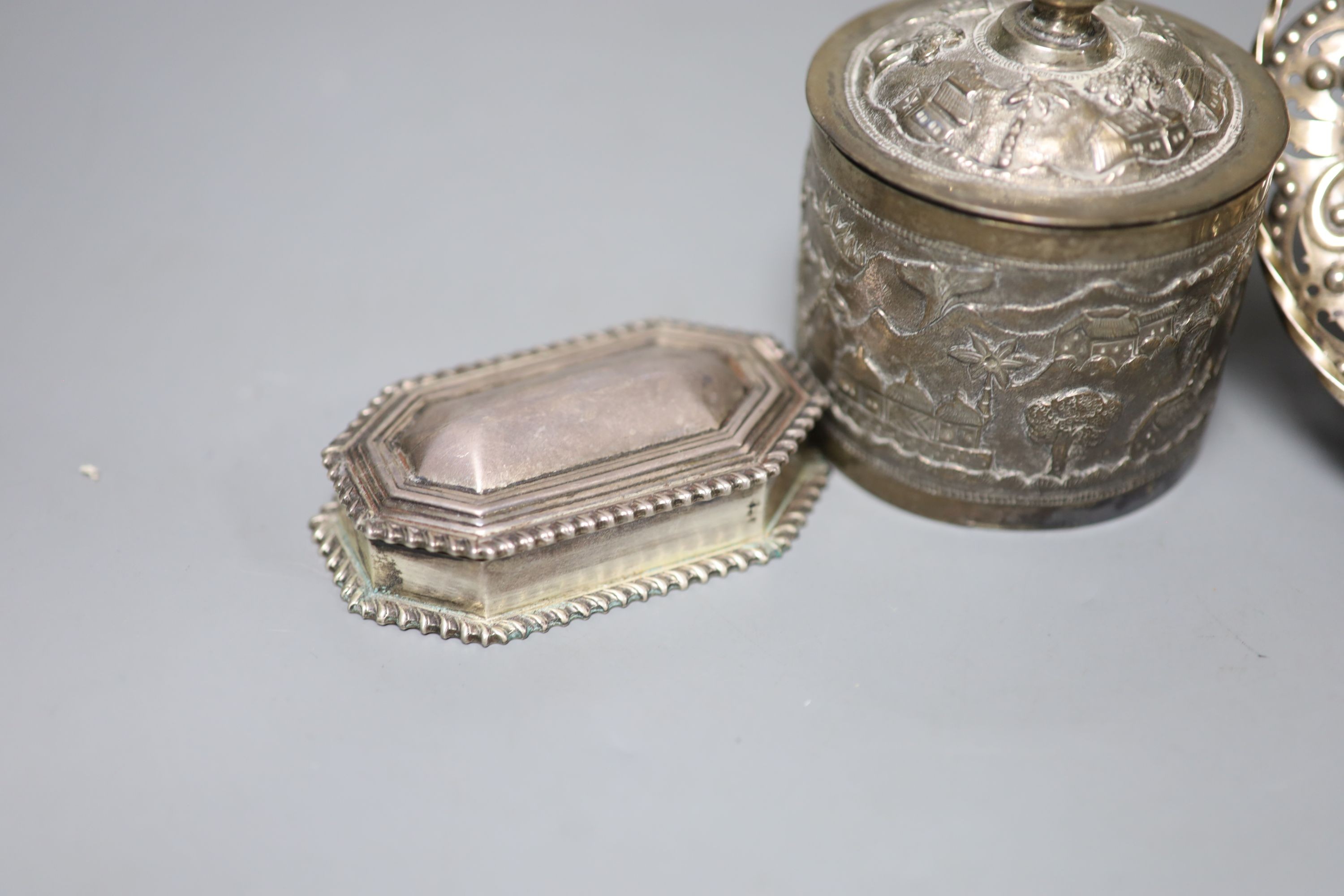 A late Victorian pierced silver basket, London, 1882, 15.7cm, a similar silver octagonal box and an Indian white metal box and cover.